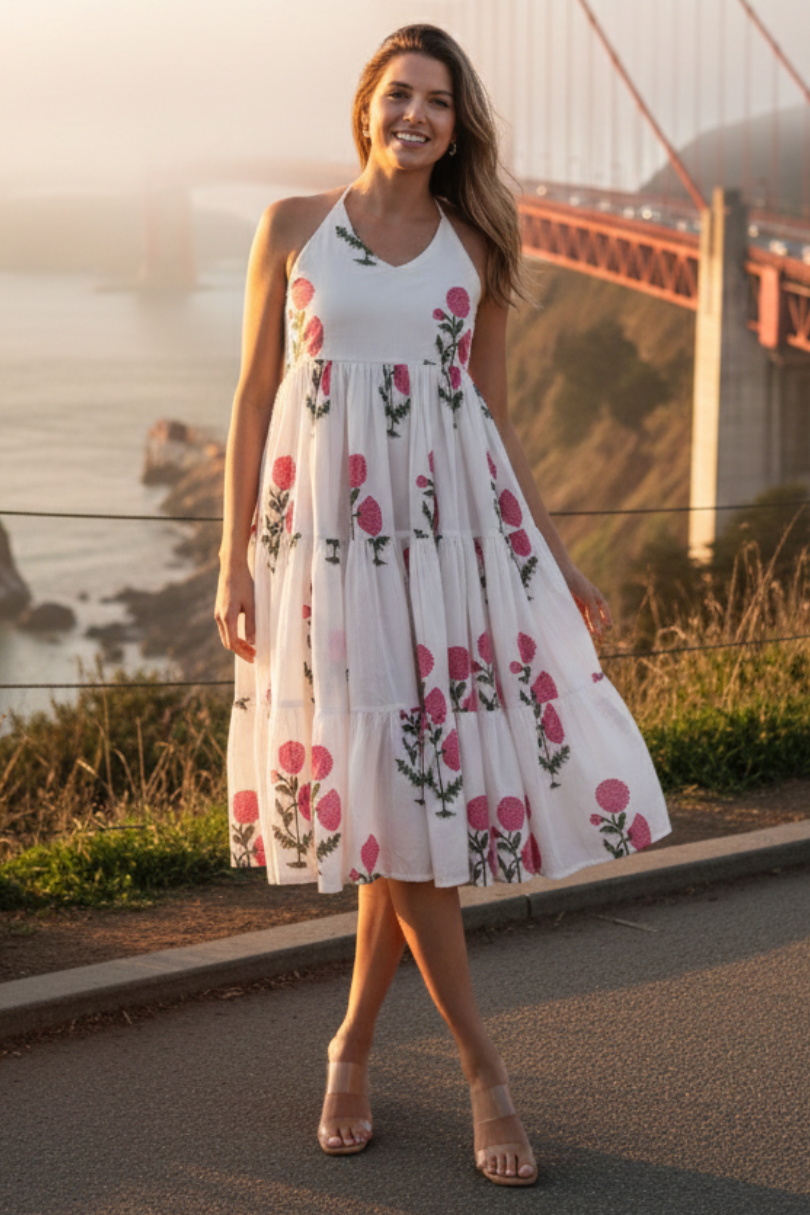 women posing in front of golden gate bridge with white dress