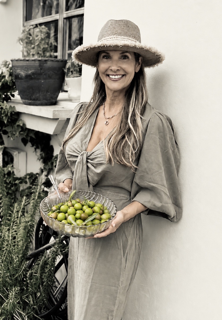 woman holding bowl of olives